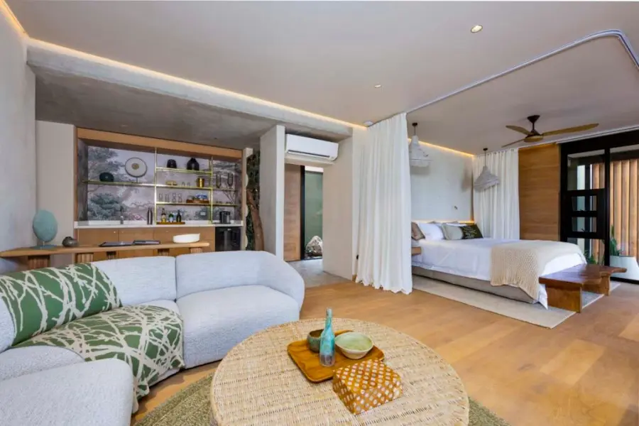 The all-new suites at RockFig Safari Lodge showing the seating area, bed, and interleading bathroom | Go2Africa