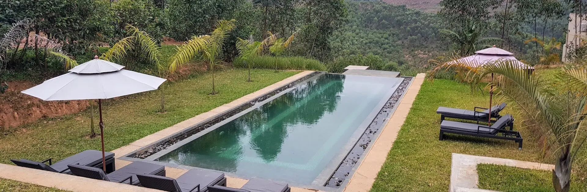 Views across the pool and loungers at Mantadia Lodge in Madagascar | Go2Africa