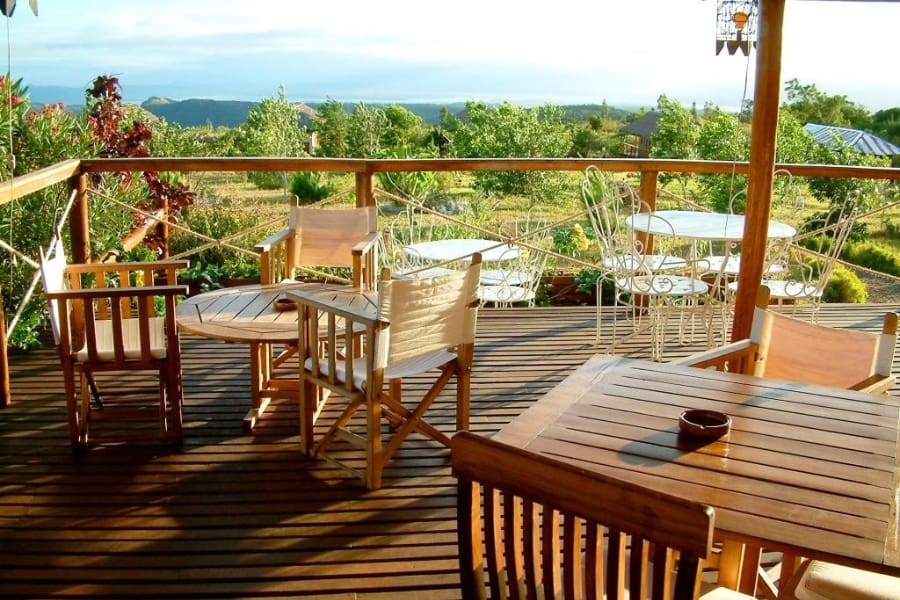 Tables on an elevated deck overlooking a lovely view | Go2Africa