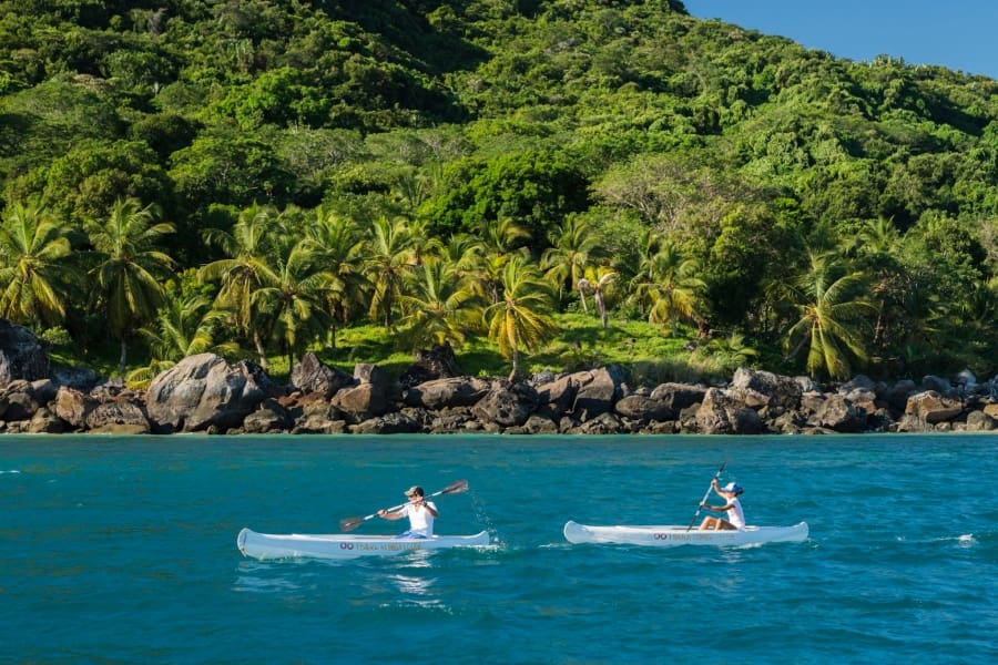 Two solo canoeists in the ocean around Tsara Komba Beach & Forest Lodge | Go2Africa