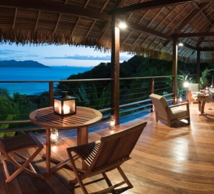 A small table and seating area overlooking the view at Tsara Komba Beach & Forest Lodge | Go2Africa