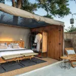 A comfortable bed with a retractable weatherproof roof revealing the night sky if you'd like.