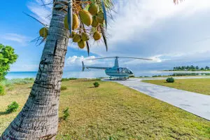 Take a helicopter to Miavana Time + Tide. 