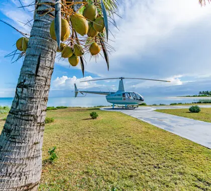 Take a helicopter to Miavana Time + Tide. 