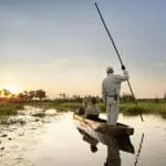 Glide along the Okavango Delta in a traditional mokoro | Sanctuary Baines Camp 
