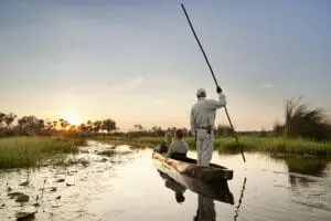 Glide along the Okavango Delta in a traditional mokoro | Sanctuary Baines Camp 