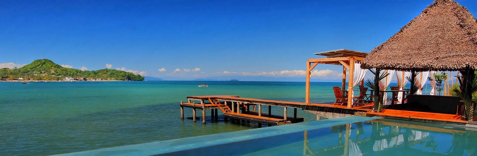 Views over the pool onto the ocean at L'heure Bleue in Madagascar | Go2Africa