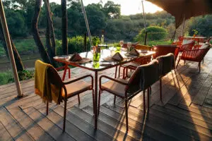 Dining on the deck overlooking the seasonal river. 