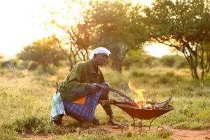 Cooking by campfire. 