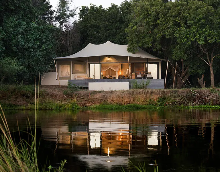 Set on a quiet stretch of the Lower Zambezi with view of the mountains.