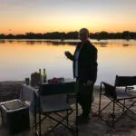 O icónico pôr do sol africano no Parque Nacional de Hwange, no Zimbabué.