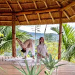 Yoga on the deck at Papaya Lake Lodge.