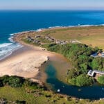 The lodge is set next to a sandy cove with a river perfect for kayaking | GweGwe Beach Lodge.