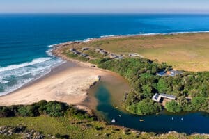 The lodge is set next to a sandy cove with a river perfect for kayaking | GweGwe Beach Lodge.