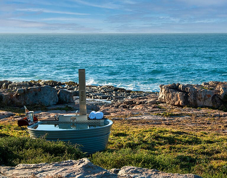 Make use of the secluded wood-fired hot tubs for a touch of extra luxury at GweGwe Beach Lodge. 