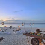 Sunset beach picnics at Mnemba Island. 