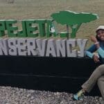 At the Ol Pejeta Conservancy sign.