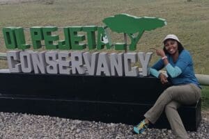 At the Ol Pejeta Conservancy sign.