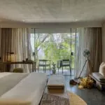 Spacious bedrooms beckon you with comfort and luxury.