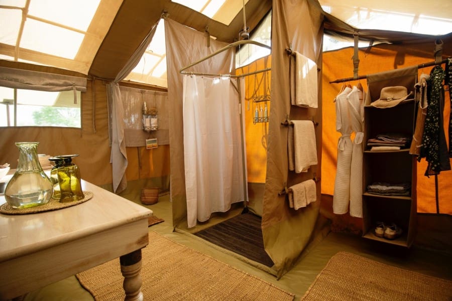Hop under a bucket shower to wash off the days adventures. 