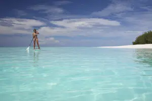 Paddle boarding on azure waters. 