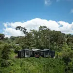 Lemala Osonjoi Lodge is nestled among lush greenery (rendered image).