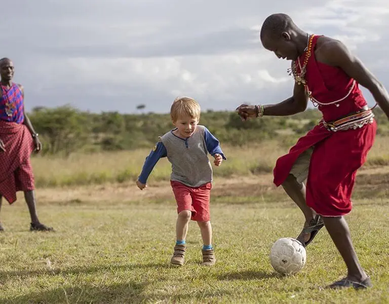 asilia-africa-encounter-mara-children-playing-outside-with-askari