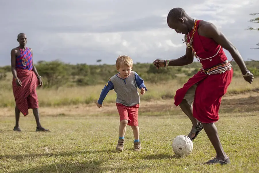 asilia-africa-encounter-mara-children-playing-outside-with-askari