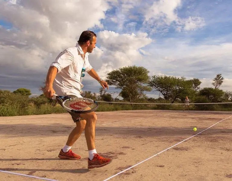 A friendly game of tennis followed by a gin & tonic at the court.