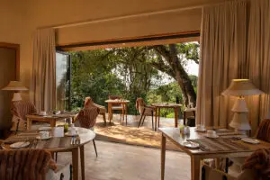 Move seamlessly between an indoor lounge and dining area and outdoor viewing deck . 