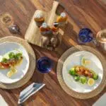 Indulge in delicious Portuguese cuisine, amidst a variety of tropical backdrops.
