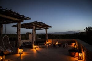 Watch the sunset from a rooftop daybed. 
