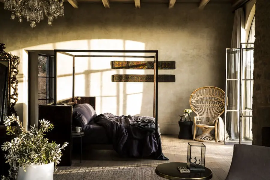 A four-poster bed welcomes you to a luxurious night's rest.