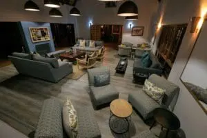 Relax in the lounge area after ordering a drink from the bar. 