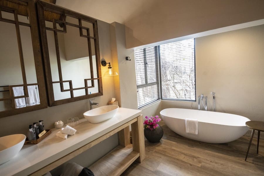 A window-facing tub provides views of the bush for the ultimate cleansing experience. 