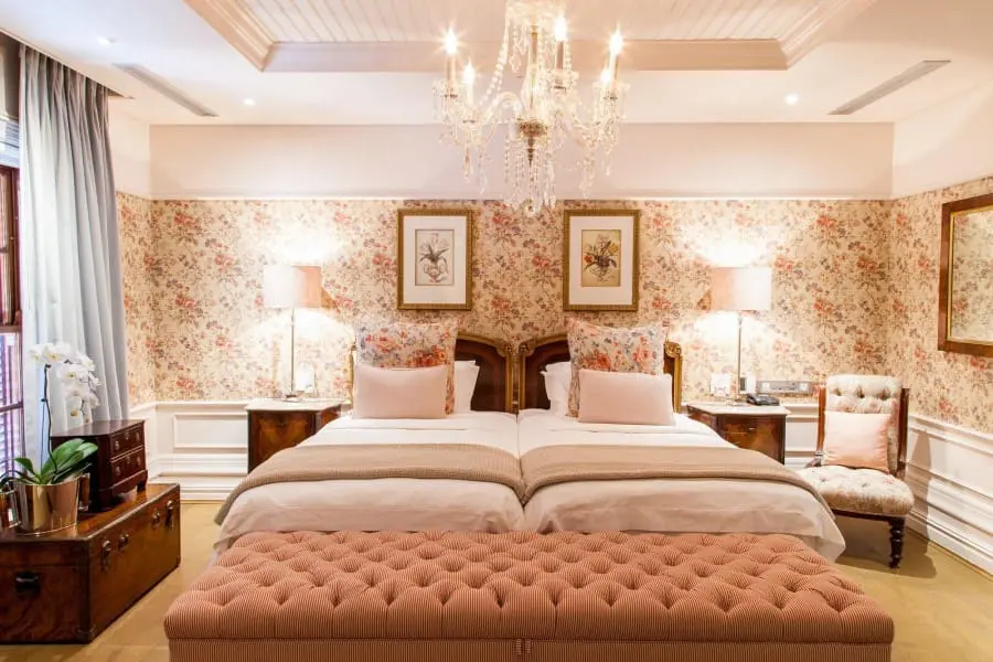 Unqiuely decorated rooms exude elegance with floral accented walls. 