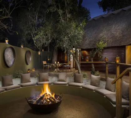Swap stories of the day's sightings around the campfire at Ulusaba Safari Lodge.
