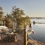 Soak in the riverside serenity at Victoria Falls River Lodge.