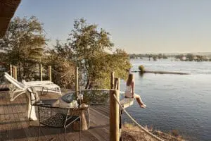 Soak in the riverside serenity at Victoria Falls River Lodge.