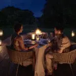 A lantern-lit bush dinner at Chobe Chilwero Lodge.