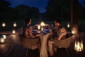 A lantern-lit bush dinner at Chobe Chilwero Lodge. 