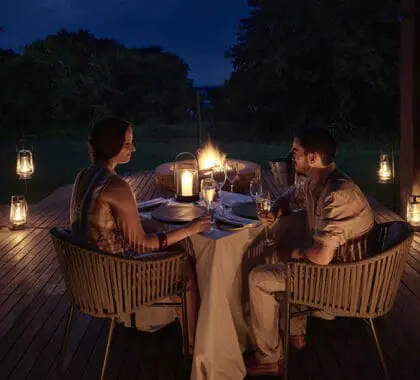 A lantern-lit bush dinner at Chobe Chilwero Lodge. 