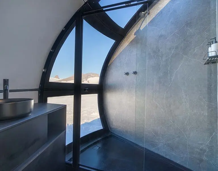 An expertly engineered shower pod has the luxury of running hot water.