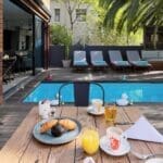 Delight in your morning breakfast next to the pool. 