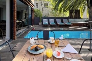 Delight in your morning breakfast next to the pool. 