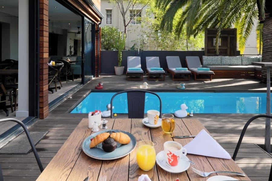 Delight in your morning breakfast next to the pool. 