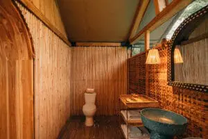 Though this is a bush camp, the en-suite bathrooms have flush toilets and hot showers.