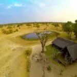 Bomani Tented Lodge is situated across from a popular watering hole, frequently visited by a variety of wildlife.