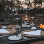 Revel in fine-dining with world-class wines by an open firepit, creating an enchanting atmosphere. 
