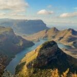 Book a helicopter flight to witness breathtaking views of ancient rivers that have shaped the Blyde River Canyon over millions of years.